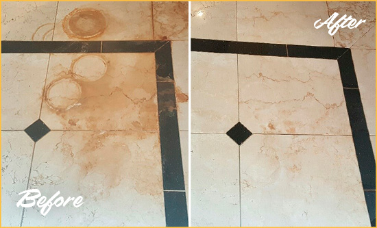 Before and After Picture of a Boulder Hard Surface Restoration Service on a Marble Floor to Eliminate Rust Stains